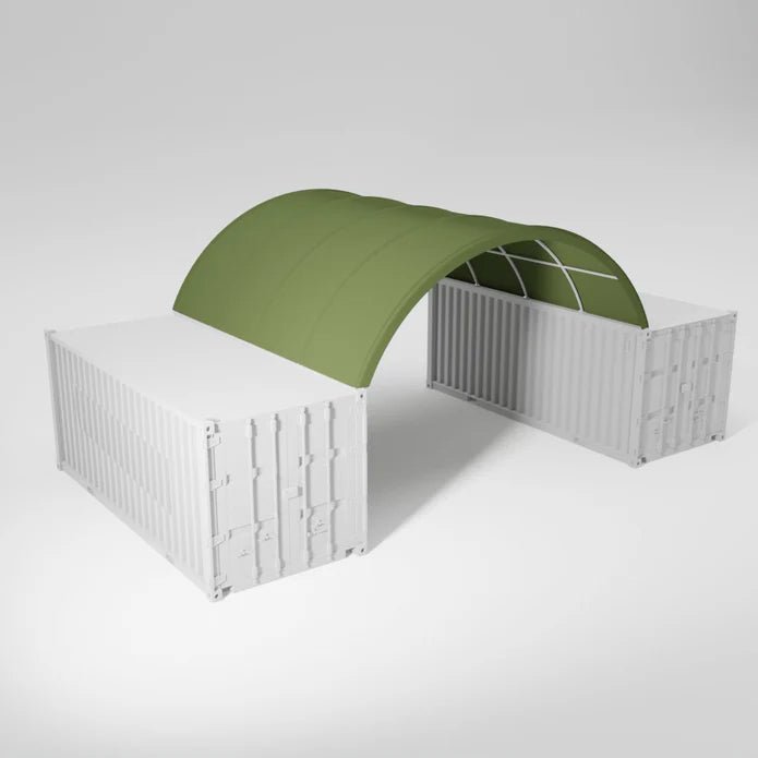 Two white shipping containers connected by a green arched canopy.